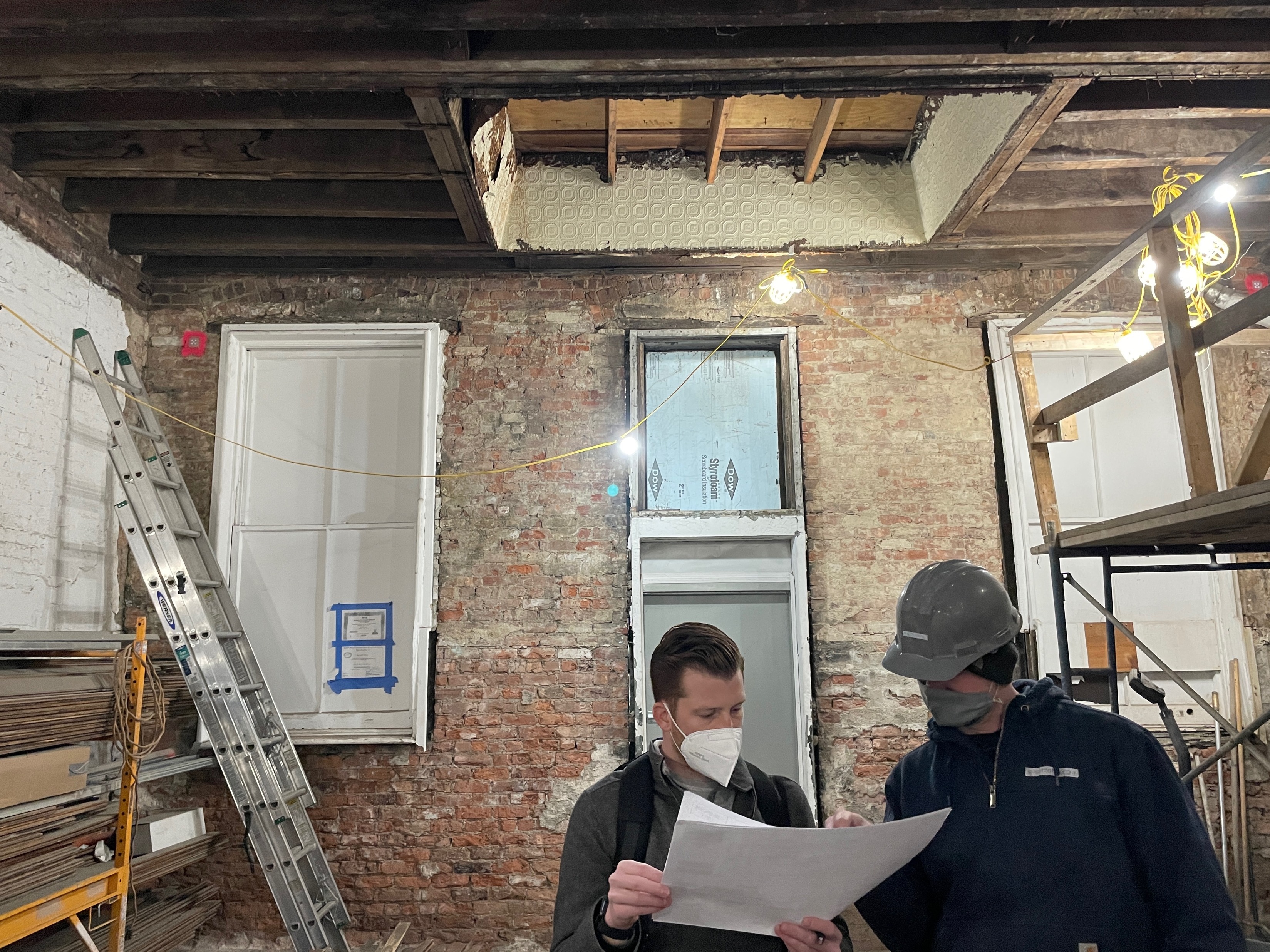 Engine 16 construction air sealing work at existing masonry opening